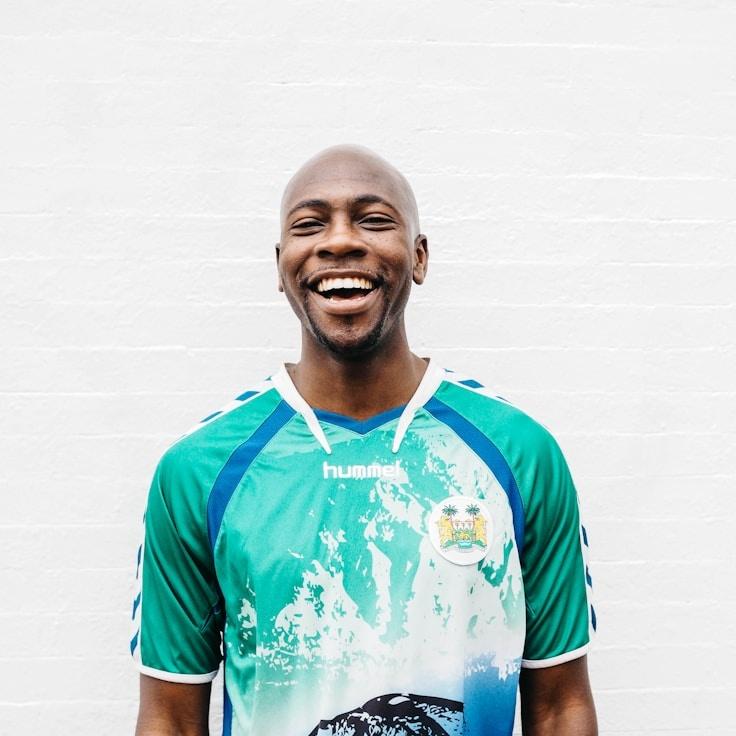 Aarav Kapoor, Lead Design Curator at Quiet Stream Framework, reviewing corporate floral arrangements